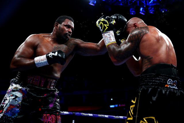 Dillian Whyte overcomes a knockdown to win a back-and-forth blockbuster, setting up a potential Deontay Wilder payday next year