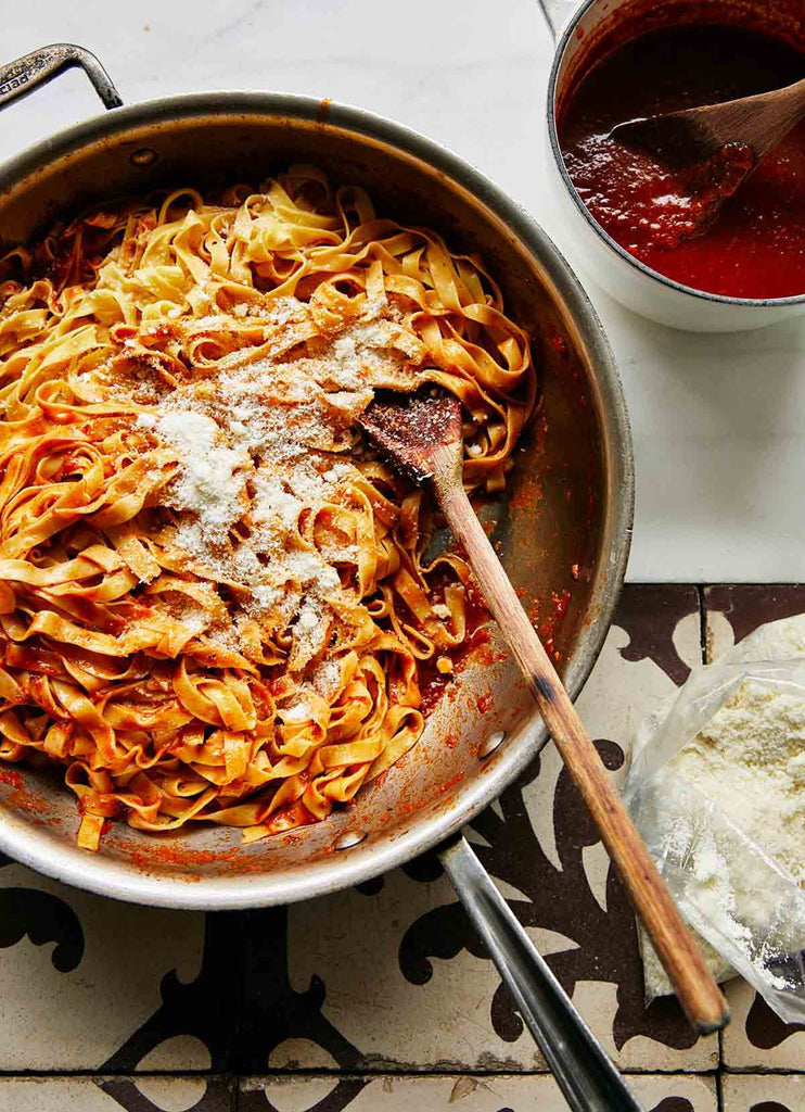 Homemade tagliatelle served with Sunday gravy and freshly grated pecorino is a traditional dish served in many, many Italian home