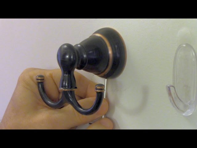 This video shows you have to install a bathroom towel or bathrobe hook.